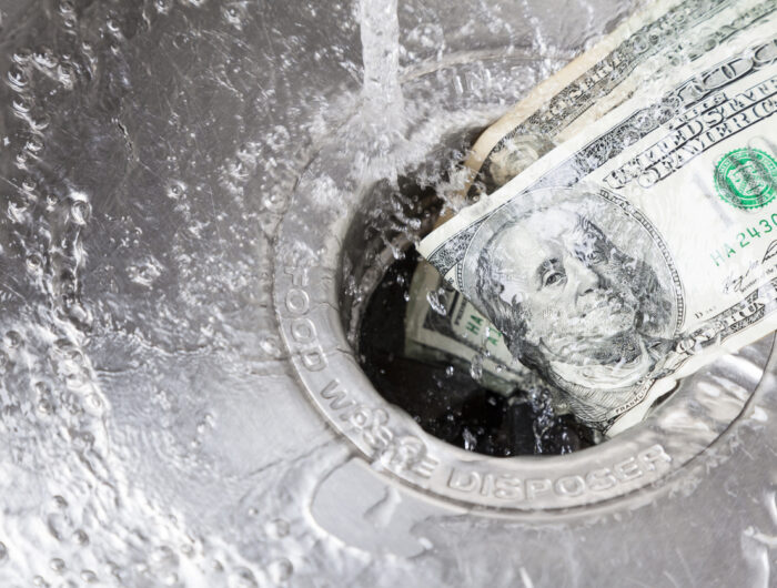 Hundred-dollar bills are going down a sink drain.