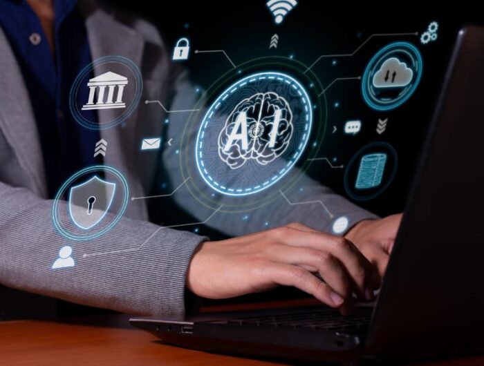 A man sits at a laptop with his fingers on the keyboard. His hands are surrounded by icons for security, backup, cloud and data transfer processes.