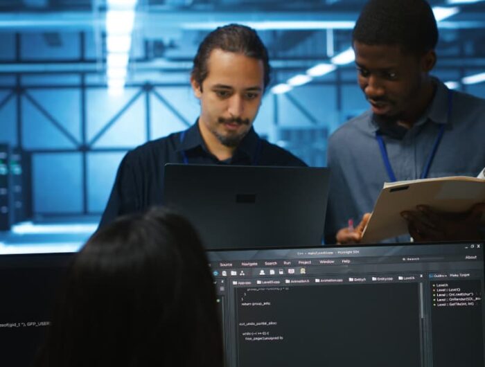 Man inspecting server hub infrastructure, reading paperwork from folder, talking with workers. Supervisor doing evaluation of data center facility workspace, verifying documents