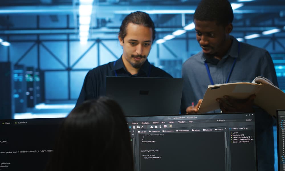 Man inspecting server hub infrastructure, reading paperwork from folder, talking with workers. Supervisor doing evaluation of data center facility workspace, verifying documents